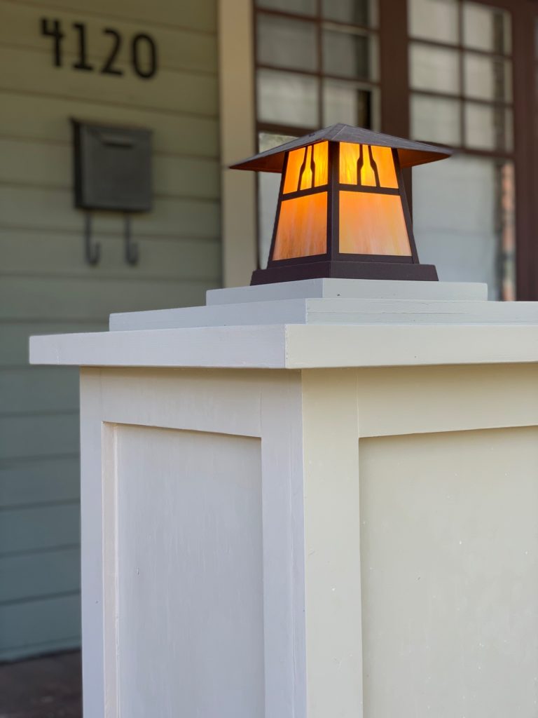 Column lighting on a bungalow front porch underscores the importance of curb appeal